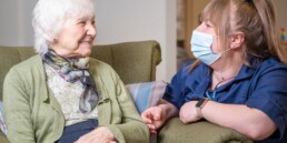A resident and carer at Lincoln Care Home